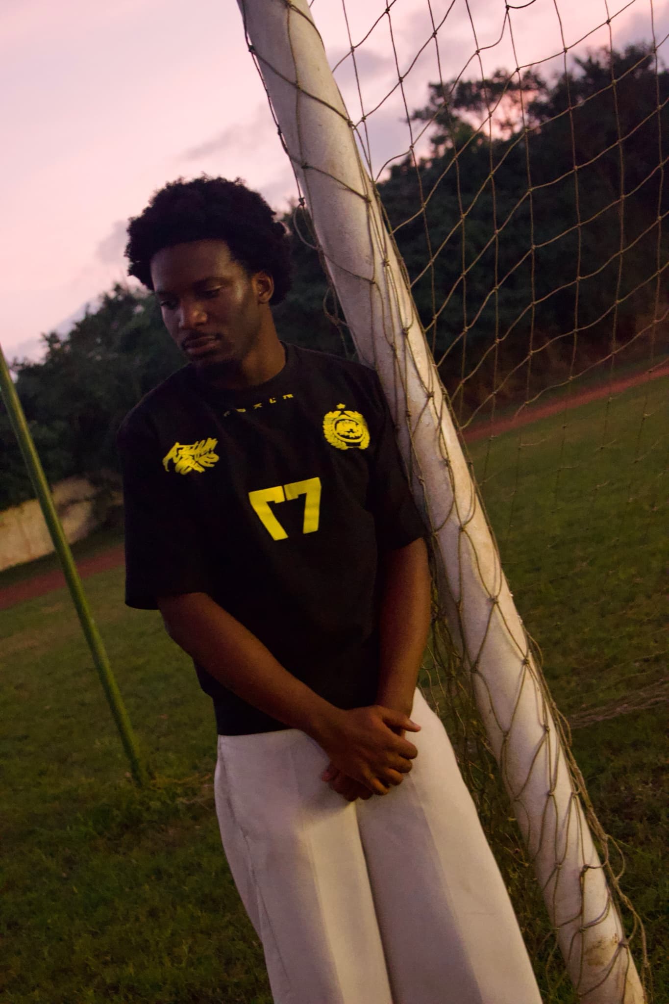 Go Gold Performance Jersey at the goalpost, dusk